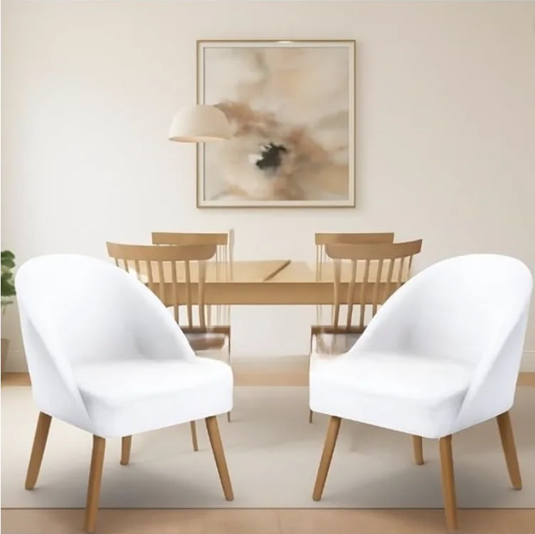 Kit com duas poltronas lua brancas ao lado de uma mesa de jantar